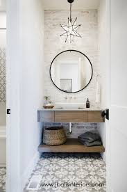 Farmhouse Bathroom With Freestanding Vanity Cement Tile And Painted Brick Wall Farmhouse Bathroom Farmhousebathr Powder Room Lighting Home Bathroom Interior