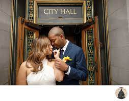 Erika and michael are a wedding photography couple who especially love working with clients who love love as much as we do. Couple In Front Of Van Ness Entrance Sf City Hall San Francisco City Hall Wedding Photographer