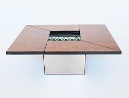 The rectangular table is made from solid mango wood and is supported by four hairpin legs with a gold finish for some retro vibes. Paul Michel Cocktail Bar Coffee Table In Burl Wood France 1970 161630