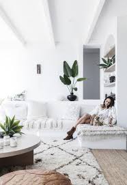 Here is another beautiful boho décor idea that uses mason jars. Beach Boho This Coastal Home Nails White On White Design Boho Living Room Contemporary Beach House Coastal Living Rooms