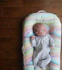 The absolute safest place for babies to sleep are on a flat, firm surface, in a separate area from the parent(s), with no obstructions such as blankets, pillows or toys. The Dock A Tot A Sleep Consultant S Review Sleep And The City