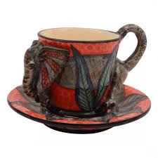 This decorative glass cup with enamel flowers and butterflies makes a great giftcredit: Elephant Espresso Cup Coffee And Tea Decorative Art Shop