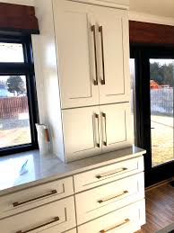 White Cabinets Champagne Gold Pulls Black Windows Quartz Countertops White Kitchen Quartz Black Windows White Modern Kitchen