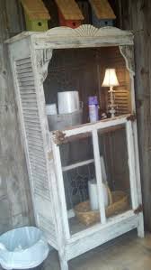 Cool Bathroom Cabinet Made From Old Shutter Doors An Old Window And Decorative Accents This Is Going Doors Repurposed Old Window Projects Diy Wood Wall