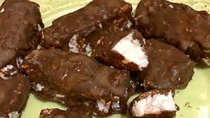 Line a baking sheet with parchment paper and set aside. Keto Dark Chocolate Coconut Bars Further Food