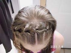 This style combines a topsy tail, an infinity braid, and a low bun for a tousled, fanciful look. 22 Topsy Tail Ideas Hair Styles Long Hair Styles Hair Beauty