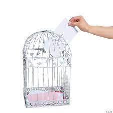 Incorporate this timeless birdcage easily into your reception decor or use it as a unique wishing well or card holder. White Birdcage Card Holder Oriental Trading