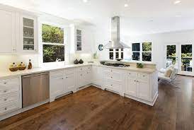 While you can use a similar stained wood floor with this color of cabinetry, in a small kitchen the effect would close the room in. Hardwood Floors In The Kitchen Pros And Cons White Kitchen Wood Floors White Kitchen Hardwood Floors Wood Floor Kitchen