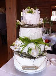 Rustic Wedding Cake Covered In Rough Royal Icing And Decorated With Dodda Vine Raffia And Fresh Flowers Cake Cake Cover Rustic Wedding Cake
