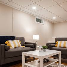 You may have a dropped basement ceiling lights with sections of fluorescent lighting of an old basement. Finished Remodeled Basement Lighting Total Basement Finishing