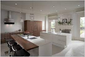 This kitchen island design keeps the kids in mind, too, so it can be a hangout space for the whole family. Sante Et Sport Modern Kitchen Countertops Contemporary Kitchen Contemporary Kitchen Cabinets