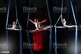Circus Actress Acrobats Performance On Canvases Team Girls Perform Acrobatic  Elements In The Air Stock Photo - Download Image Now - Istock
