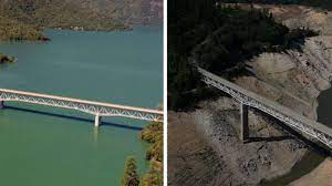 Justin sullivan/getty images a truck drives on the enterprise bridge over a section of lake oroville on april 27. Photos Before And After Images Show Impact Of Calif Drought Oroville Lake Oroville Camping Area