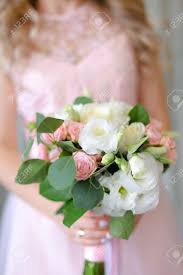 Maybe you would like to learn more about one of these? Close Up Cute Bouquet Of Flowers In Light Pink Dress Background Concept Of Wedding Photo Session And Bride Stock Photo Picture And Royalty Free Image Image 122199687