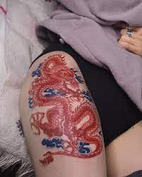 Swan Tattooing S Instagram Photo Red Dragon With Blue Clouds Thx Emily Red Tattoos Red Ink Tattoos Blue Ink Tattoos