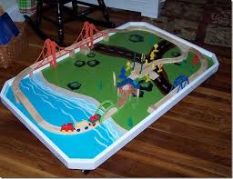 In this case, she actually took apart an old train table that wasn't really working for them. Christmas Crafting The Train Table A Handmade Childhood Train Table Model Train Table Wooden Train