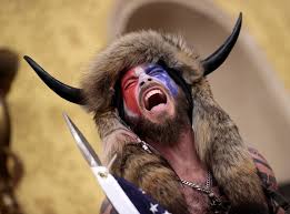 One of them, jake angeli, is known as the q shaman for the ridiculous qanon costumes he wears. Jake Angeli The Qanon Shaman Who Stormed The Us Capitol The Independent