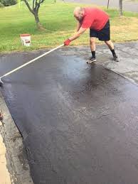 If you plan to topcoat your driveway, you'll need to fix the cracked driveway first and do asphalt repair later. How To Seal Coat A Driveway Driveway Repair Asphalt Driveway Repair Diy Driveway