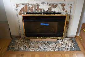 With a rubber mallet take out the base of the mantle. Fireplace Demolition Day The Handyman S Daughter