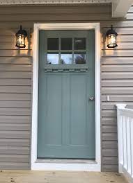 Apply painter's tape to the edges of your doorknob, the door's windows, hinges, and any other details you want to protect from paint. Sherwin Williams Blue Seagrass Exterior Paint Colors For House Exterior House Paint Color Combinations Front Door Paint Colors