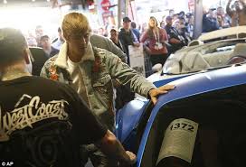 This flat black ferrari f430 has 20″ gloss black wheels in the front and 22″ gloss black wheels in the rear and red pinstripes to match the. Justin Bieber Auctions Off Custom Ferrari In Arizona Daily Mail Online