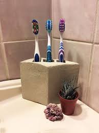 Here's a clever storage idea: Cement Toothbrush Holder Hometalk