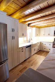 At times raw and weathered, and at others softly distressed, this warm and relaxed design style brings the charm of the outside in. Log Cabin Rustic White Kitchen Cabinets With Granite And Wood Countertops Rustic Kitchen Cleveland By Cabinet S Top Houzz Au