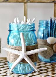 A beachy living room with a gorgeous artwork, light blue chairs, a cork table and a rug. 33 Best Ocean Blues Home Decor Inspiration Ideas And Designs For 2021