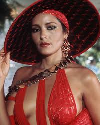 Barbara Carrera as Fatima Blush in Never Say Never Again According to  Carrera she was initially offered to star alongside Roger Moore in  Octopussy. She was ready to sign up , however