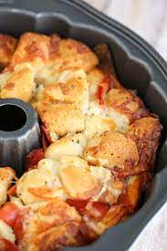This Easy Pizza Monkey Bread Is Stuffed With Pepperoni Mozzarella Cheese And Garlic All In A Bundt Pan Pizza Monkey Bread Monkey Bread Recipes Monkey Bread