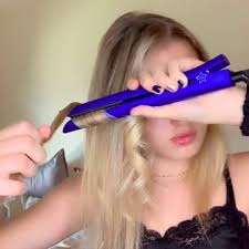 Feed a section of hair through your open flat iron, clamp the plates down about an inch or two from your roots, and then wrap the section around the iron once, sliding it down the length of the section. Best Tiktok Beauty Hacks And Tutorials Popsugar Beauty