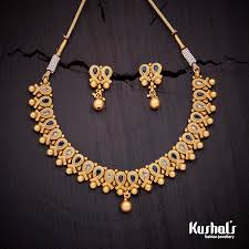 Black And Gold Jewelry Beautifully Crafted Antique Necklace Studded With White And Green Stones And Plated With Antique Necklaces Design Antique Bridal Jewelry Gold Jewelry Fashion
