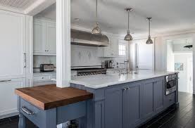 Beautiful Kitchen With White Cabinets White Marble Countertop And Dark Blue Island Dark Blue Kitchens Grey Blue Kitchen Blue Kitchen Cabinets
