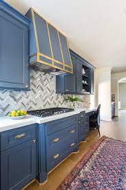 Dark blue kitchen cabinets with brass hardware. 6 Hardware Styles To Pair With Deep Blue Shaker Cabinets