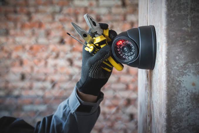 Security camera hardware installation close-up