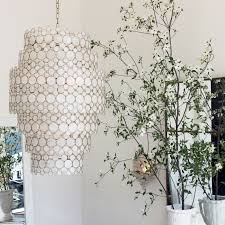 Oly Moly The Serena Waterfall Chandelier From Olystudio Features A Handcrafted Brass Fra Houston Interior Designers Waterfall Chandelier Houston Interiors