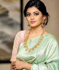 In A Green Color Saree Elbow Length Sleeve Blouse Design Necklace And Jewelry Saree Hairstyles Designer Saree Blouse Patterns Saree Blouse Patterns