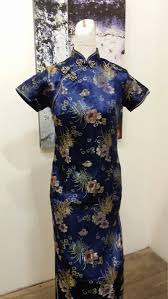 Tab ends at the back bodice extend over the front shoulder edge and fasten with a button. Pin On Vintage Dresses