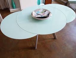 Gate legged dining tables have been around for a long time now, and they still provide a good answer for small homes that lack an area in which to set up a long table permanently. The Butterfly Expandable Round Glass Dining Table Expand Furniture Folding Tables Smarter Wall Beds Space Savers