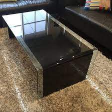 It has beige leather seats and a black center table lighted by a crystal chandelier. Dare Gallery Tempered Glass Coffee Table Home Furniture Furniture On Carousell