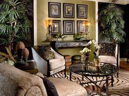 Decorate your living room with a safari theme to create an exotic look. Jungle Themed Sitting Room Safari Living Rooms African Decor Living Room African Living Rooms