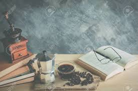 Coffee table books reveal so much about a person. Vintage Coffee Maker Moka Pot And Manaul Grinder Coffee With Book And Glasses On Table Stock Photo Picture And Royalty Free Image Image 70286924