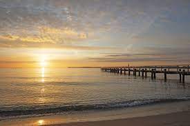 bild mit sonnenaufgang ostsee lichtstimmungen morgenstimmung lichtstimmung travemunde sonnenaufgang strand sonnenaufgang bilder