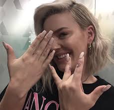 Anne-Marie Tattoo Guide: The Meaning Behind Her Body Ink Revealed