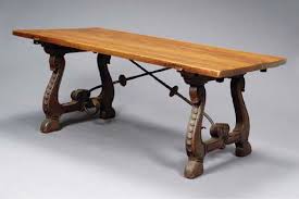 Stand can be used for display of fruit or flowers. A Spanish Baroque Style Oak And Wrought Iron Dining Table
