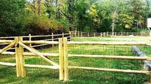 A split rail fence is great for both ranches and farms, as well as suburban settings if you want a more rustic and casual feel. 3 Rail Round Cedar Post And Rail Fence With Wire Cedar Posts Post And Rail Fence Rail Fence