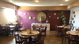 Invites you onto the patio to the tiled mint and black floor bar to the beautiful white ceramic dishes and latticed chairs. Za Atar Mediterranean Restaurant Mediterranean Restaurant In Tucson