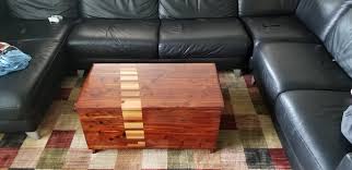 An extraordinary coffee table in a triangle shape, which makes it a top choice for an used corner, for example behind the sofa. A Modified Cedar Chest Coffee Table Narrowed Added Section Of Laminated Sapele Hickory Maple Some Other Wood In The Shop Add Lift Top Hardware Underneath Waterlox Finish Tv Table Trays Finally Gone Woodworking