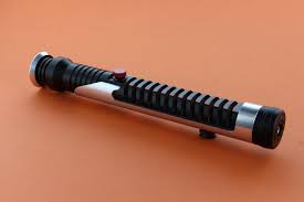 The hilt is primarily black along with a metallic silver colored av switch and metallic silver colored shroud. Ultimate Works Master Q Qui Gon Jinn Lightsaber Lightsaber Clone Wars Star Wars