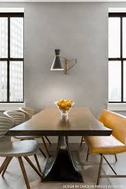 The exposed edison bulb inside the steel cage frame adds interest while providing ample light to any space. Dining Table Dining Table Dining Sconces Live Edge Dining Table